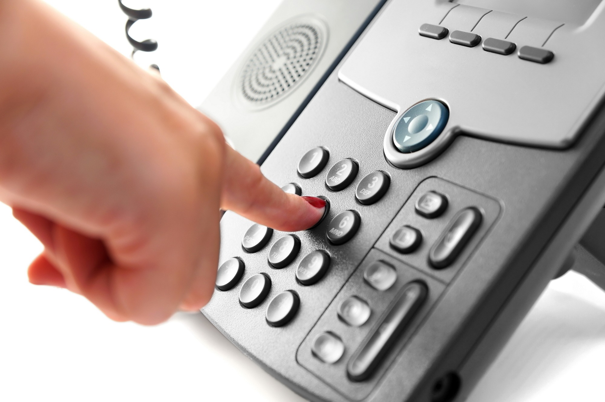 woman hand is dialing a phone number with picked up headset